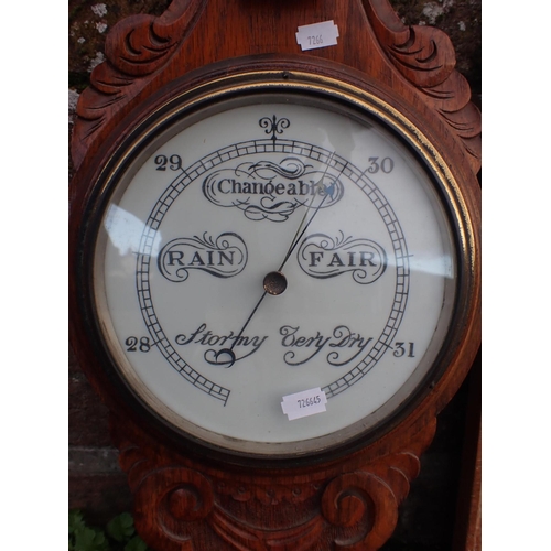 94 - A VICTORIAN WIRE WORK FENDER with brass trim, length 77 cms, with a barometer with carved wood mount... 