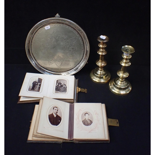 96 - A PAIR OF BRASS CANDLESTICKS with a plated tray and two albums of Victorian carte de visite photogra... 