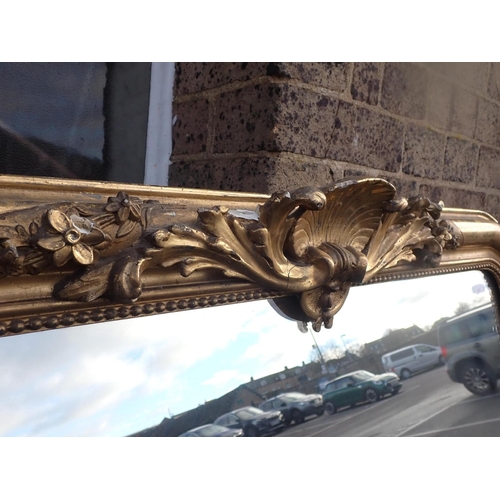 964 - A 19TH CENTURY GILT-FRAMED OVERMANTEL MIRROR with old gilding, label for 'G. CHAVOUTIER, Rue Ganteri... 