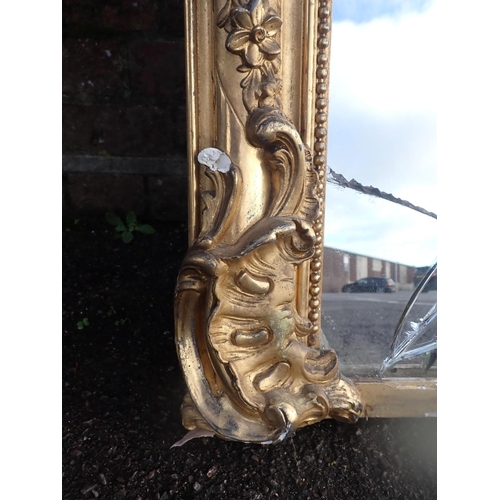 964 - A 19TH CENTURY GILT-FRAMED OVERMANTEL MIRROR with old gilding, label for 'G. CHAVOUTIER, Rue Ganteri... 