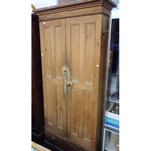 972 - A VICTORIAN STRIPPED PINE WARDROBE the pair of four-panelled doors enclosing a painted interior, lat... 