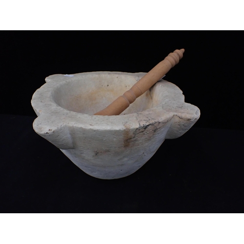 11 - A LARGE OLD MARBLE MORTAR 37cm wide including lugs, with a wooden pestle