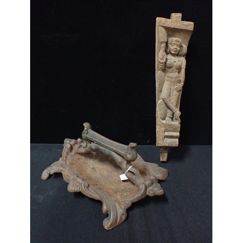 3 - AN INDIAN CARVED HARDWOOD FRAGMENT carved with a standing figure 46cm, and a reproduction cast iron ... 