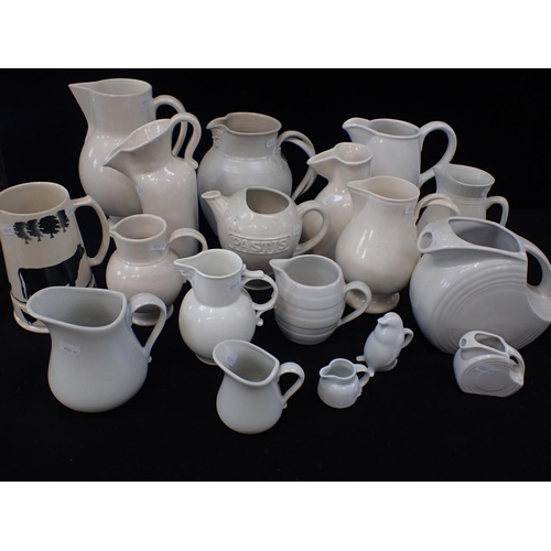 33 - A COLLECTION OF WHITEWARE JUGS, FIESTA WARE Leeds, etc, all modern productions mostly in vintage sty... 