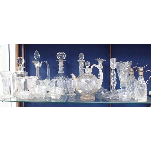 46 - A COLLECTION OF 19th CENTURY GLASS: AN ENGRAVED VESSEL decanters, vases, a pair of candlesticks (one... 