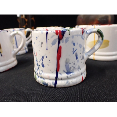 72 - EIGHT PAINT SPATTERED SMALL MUGS with a Poole Pottery modernist vase and another studio pottery vase