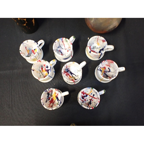 72 - EIGHT PAINT SPATTERED SMALL MUGS with a Poole Pottery modernist vase and another studio pottery vase