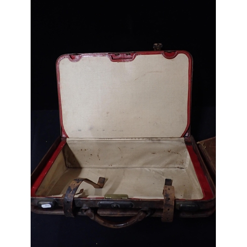 109 - A VINTAGE LEATHER PORTMANTEAU BY FINNIGANS, MANCHESTER and a small leather suitcase (a/f) (2)