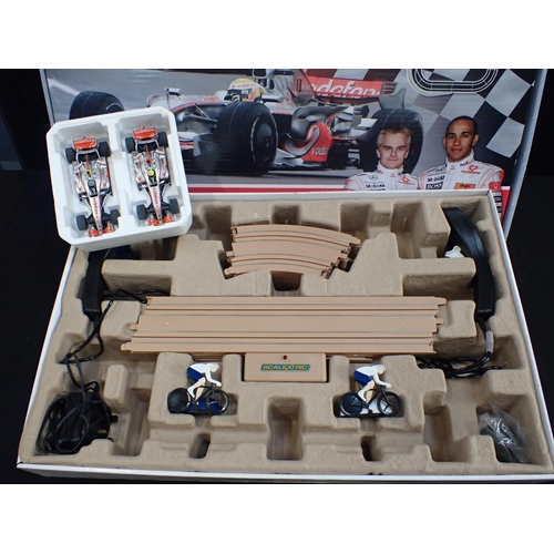 189 - SCALEXTRIC BOXED SETS Vodafone McLaren Mercedes and Team GB Velodrome Cycling