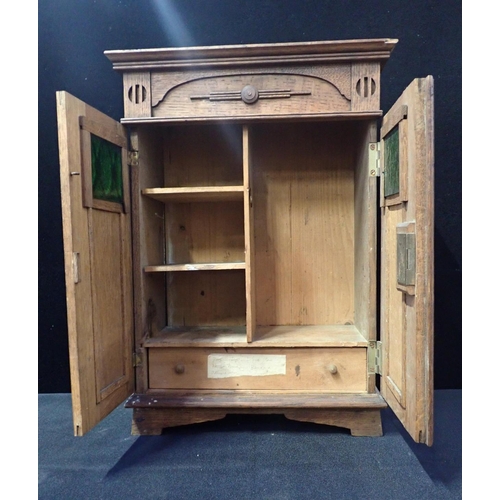 215 - AN EDWARDIAN STYLE MINIATURE WARDROBE oak, with two doors with glass panels, fitted interior, width ... 