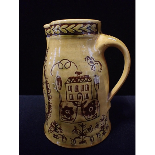 278 - MARY WONDRAUSCH (ATTRIBUTED TO): A SLIPWARE MARRIAGE JUG sgraffitto decorated with a Church, birds a... 