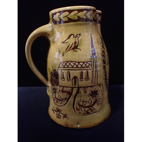 278 - MARY WONDRAUSCH (ATTRIBUTED TO): A SLIPWARE MARRIAGE JUG sgraffitto decorated with a Church, birds a... 