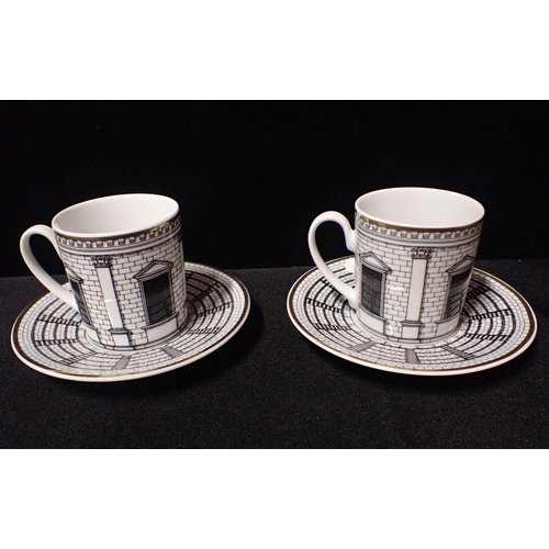 288 - A PAIR OF ROSENTHAL FORNASETTI 'PALLADIANA' COFFEE CANS and saucers (one apparently a 'second')