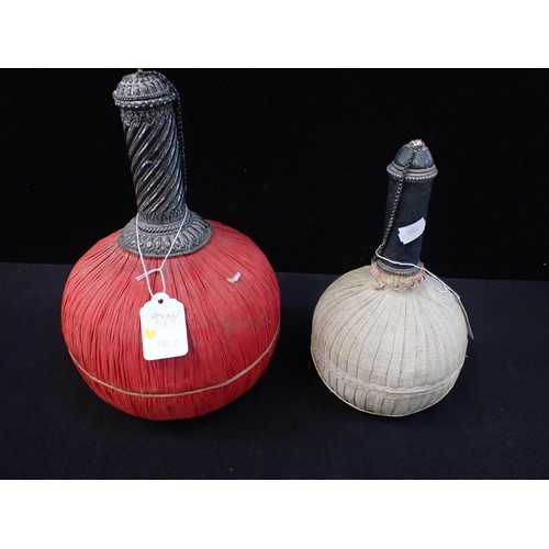 300 - TWO PERSIAN BOTTLE FLASKS WITH WHITE METAL MOUNTS and covered in cloth 29cm and 24cm