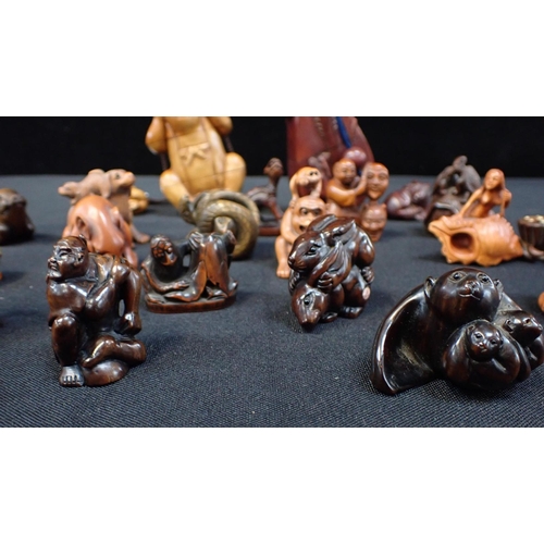 308 - A COLLECTION OF JAPANESE BOXWOOD NETSUKE (19) to include rabbits, pis and tortoise, some signed and ... 