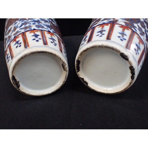 313 - A PAIR OF CHINESE VASES, UNDERGLAZE BLUE WITH 'CLOBBERED' IRON RED and profuse gilding, and ring 'ha... 