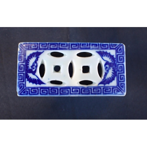 314 - CHINESE BLUE AND WHITE PORCELAIN PILLOW Two celadon plates, two prunus vases,