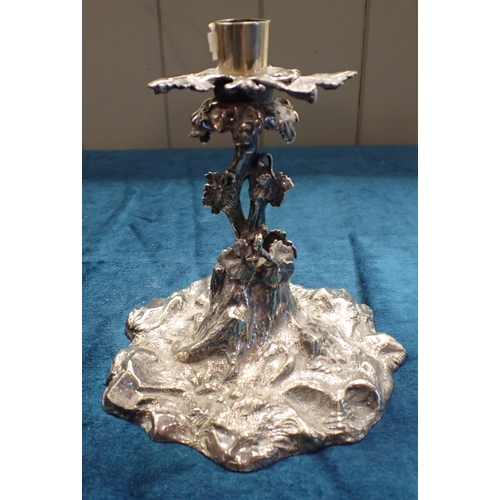 328 - A WHITE METAL CANDLESTICK