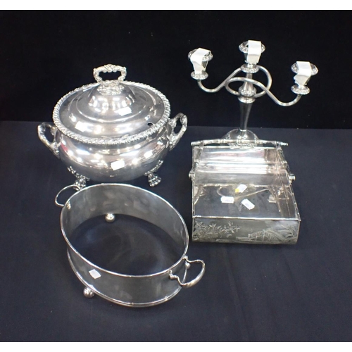 339 - A SILVER PLATED CIRCULAR TWO HANDLED SAUCE TUREEN AND COVER with gadrooned and leaf mounts, on paw f... 