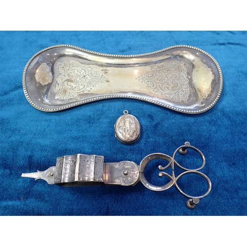 391 - A SILVER PLATED CANDLE SNUFFER AND TRAY with an unmarked white metal locket