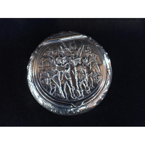 400 - A DUTCH REPOUSSE SILVER CIRCULAR SNUFF BOX with pictorial lid, and with import marks