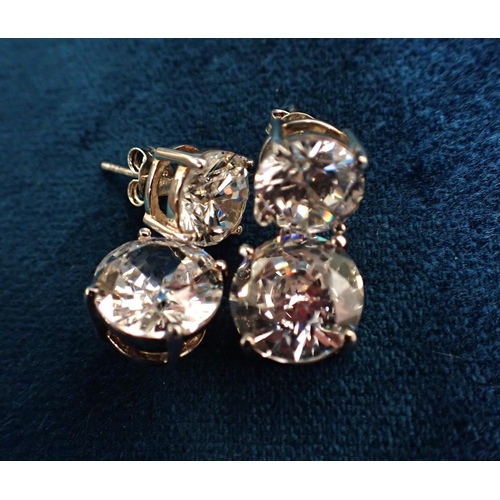 422 - A LARGE PAIR OF CUBIC ZIRCONIA DROP EARRINGS in sterling silver, each set with a round brilliant cut... 