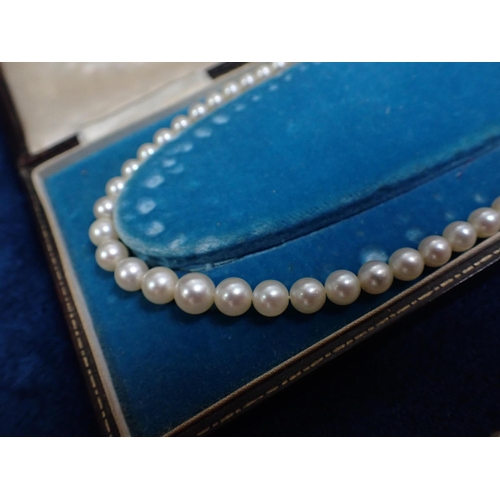 447 - A THREE STRAND PEARL NECKLACES A graduated cultured pearl necklace with a 9ct white gold clasp, two ... 