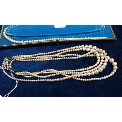 447 - A THREE STRAND PEARL NECKLACES A graduated cultured pearl necklace with a 9ct white gold clasp, two ... 