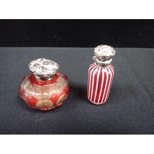 487 - A GROUP OF 19TH CENTURY SCENT BOTTLES one Nailsea type, two double-ended, some silver topped, and a ... 