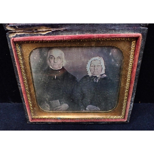 494 - A CASED DAGUERROTYPE PORTRAIT OF AN ELDERLY COUPLE with a cased ambrotype, and an empty case (3)