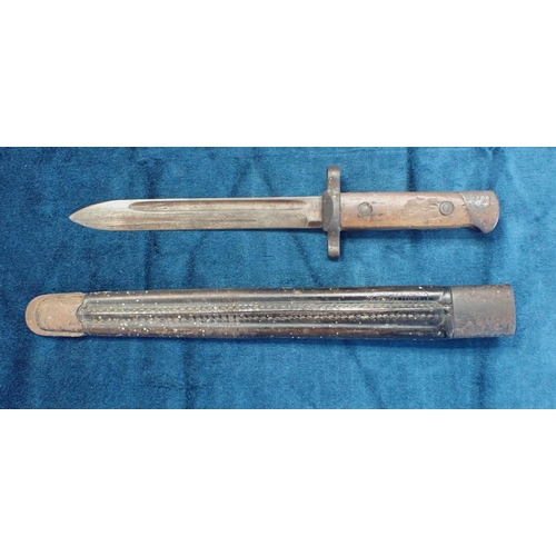 524 - AN OLD BRITISH BAYONET hilt marked G24845 Calcutta, 29cm long, the associated scabbard marked G. Onu... 