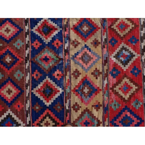 744 - A LARGE ANATOLIAN KILIM, EARLY 20TH CENTURY 187 x 335cm (a/f, worn, patched, unevenly faded)