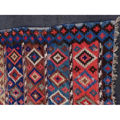 744 - A LARGE ANATOLIAN KILIM, EARLY 20TH CENTURY 187 x 335cm (a/f, worn, patched, unevenly faded)