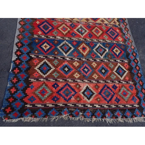 744 - A LARGE ANATOLIAN KILIM, EARLY 20TH CENTURY 187 x 335cm (a/f, worn, patched, unevenly faded)