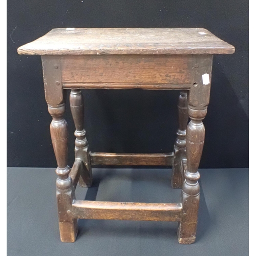 748 - AN 18TH CENTURY OAK JOINT STOOL 56cm high (one leg repaired)