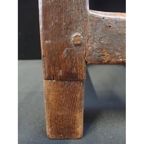 748 - AN 18TH CENTURY OAK JOINT STOOL 56cm high (one leg repaired)