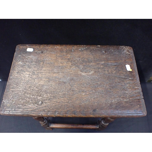 748 - AN 18TH CENTURY OAK JOINT STOOL 56cm high (one leg repaired)