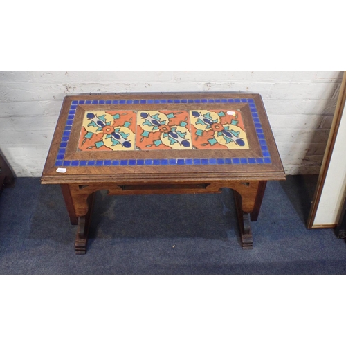 772 - AN ARTS AND CRAFTS STYLE OAK AND TILED TABLE with vividly coloured tile inserts, inscribed beneath; ... 