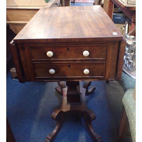 775 - A REGENCY MAHOGANY WORK TABLE with drop flaps and two drawers, on square column and scrolling legs 5... 