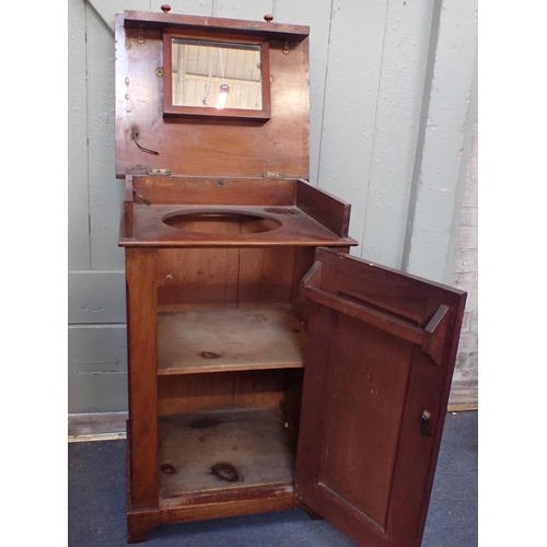 776 - A VICTORIAN 'CAMPAIGN' STYLE MAHOGANY ENCLOSED WASHSTAND with hinged top and dummy drawer over basin... 