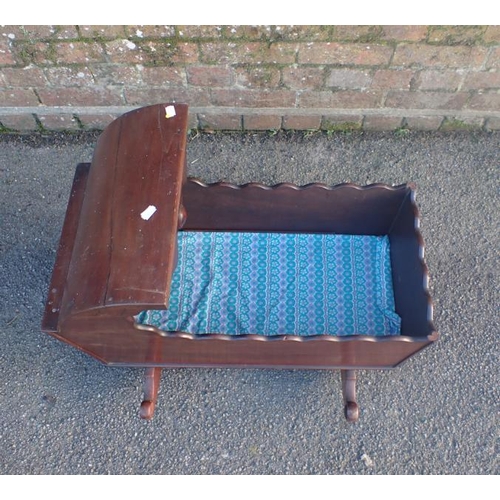 801 - A 19TH CENTURY MAHOGANY ROCKING CRIB 66cm long (some damage)