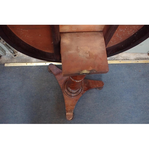 803 - A 19TH CENTURY MAHOGANY TRIPOD TABLE with circular top and (unevenly shaped) platform base 54cm dia