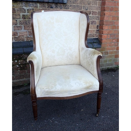 816 - A 19TH CENTURY MAHOGANY WINGBACK ARMCHAIR with moulded frame, serpentine seat, and slender reeded le... 