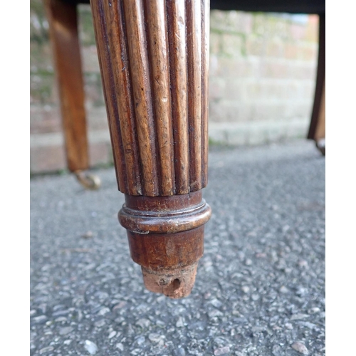 816 - A 19TH CENTURY MAHOGANY WINGBACK ARMCHAIR with moulded frame, serpentine seat, and slender reeded le... 