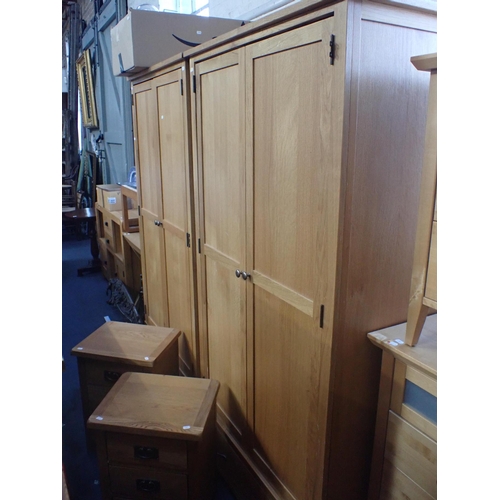 819 - A PAIR OF MODERN OAK WARDROBES 98cm wide (with assembly instructions; lacking screws tor hinges), an... 