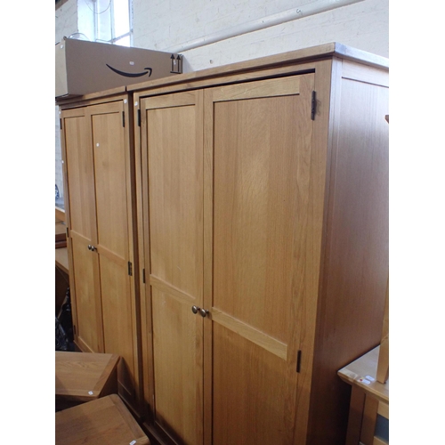 819 - A PAIR OF MODERN OAK WARDROBES 98cm wide (with assembly instructions; lacking screws tor hinges), an... 