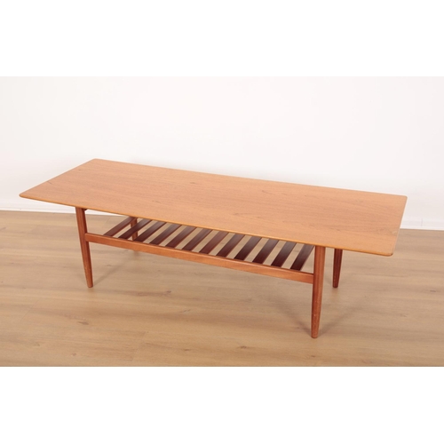 1 - A MID-CENTURY G PLAN TEAK COFFEE TABLE

with slatted shelf beneath and tapering rounded legs, 160cm ... 