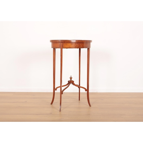 10 - A SATINWOOD OCCASIONAL TABLE BY MAPLE &  CO

bearing label to the underside, the ebony strung oval t... 