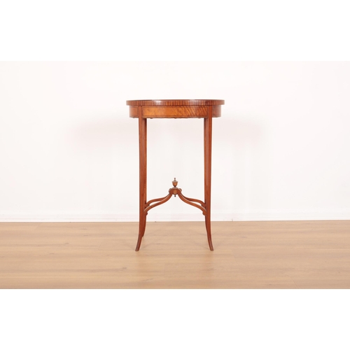 10 - A SATINWOOD OCCASIONAL TABLE BY MAPLE &  CO

bearing label to the underside, the ebony strung oval t... 