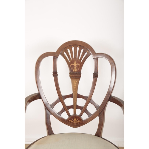 12 - A PAIR OF EDWARDIAN MAHOGANY ARMCHAIRS IN HEPPLEWHITE STYLE

with satinwood inlays of classical deco... 